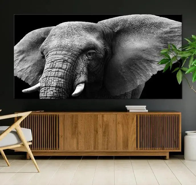 The "Big Elephant Close Up Wall Art Canvas Print" showcases a striking black and white elephant design. Printed on museum-quality canvas with a UV-protective coating, it is ready to hang and effortlessly combines elegance and style in any room.