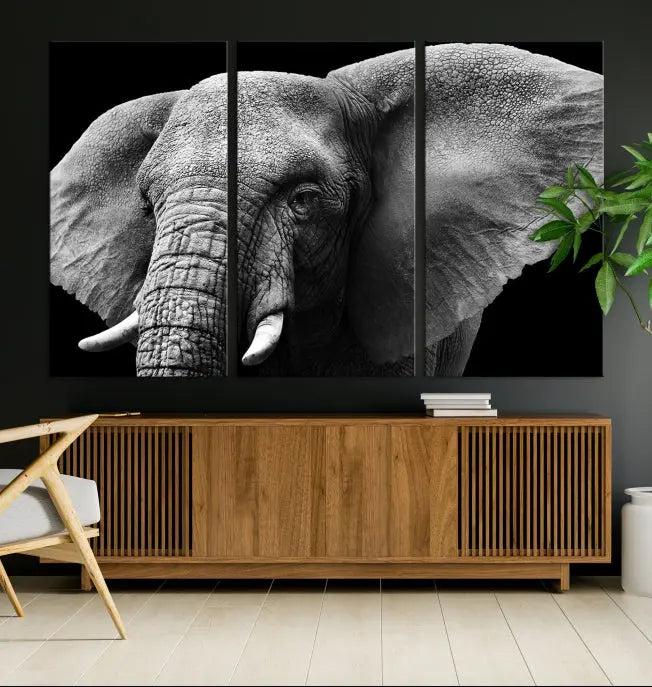 The "Big Elephant Close Up Wall Art Canvas Print" showcases a striking black and white elephant design. Printed on museum-quality canvas with a UV-protective coating, it is ready to hang and effortlessly combines elegance and style in any room.