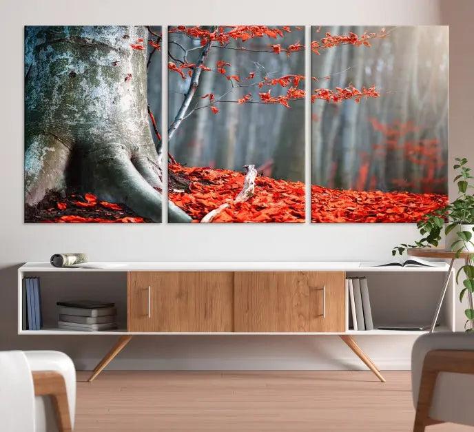 The "Big Tree and Forest Red Leave Wall Art Canvas Print" adorns the wall, featuring a striking triptych of a forest scene with a large tree trunk and vibrant red leaves. This artwork is printed on museum-quality Polycotton canvas and comes ready to hang, offering both elegance and durability.