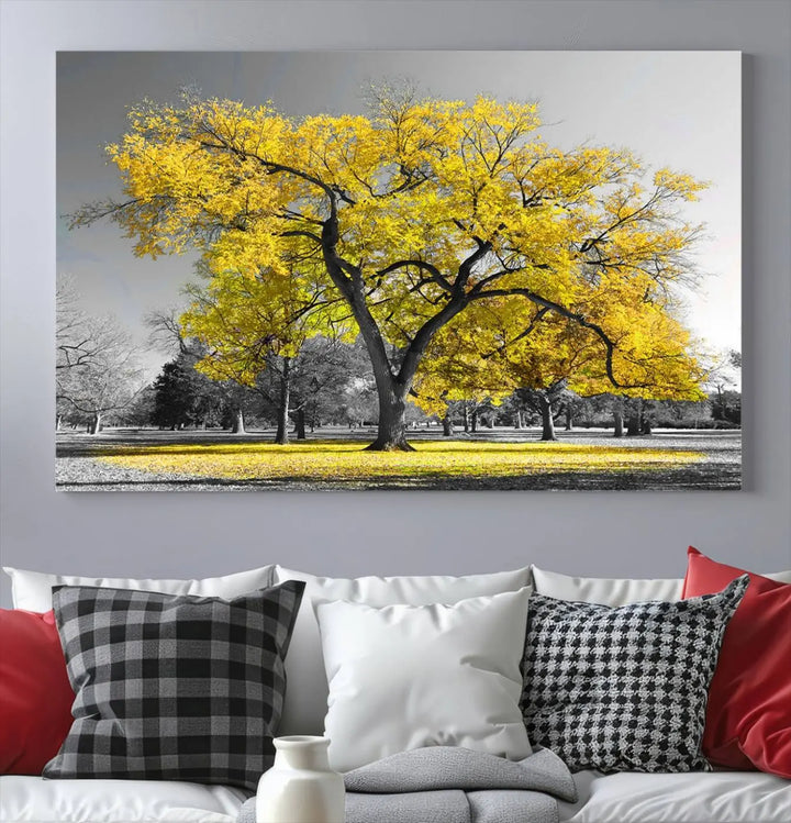 The "Big Yellow Tree Canvas Wall Art Print Black White Yellow Art Painting" showcases a large yellow tree in a park.