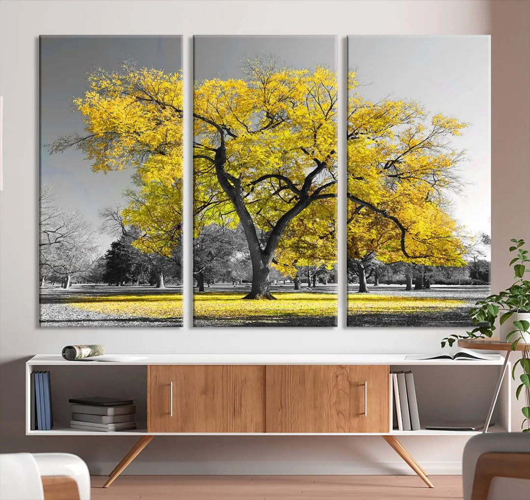 The "Big Yellow Tree Canvas Wall Art Print Black White Yellow Art Painting" showcases a large yellow tree in a park.