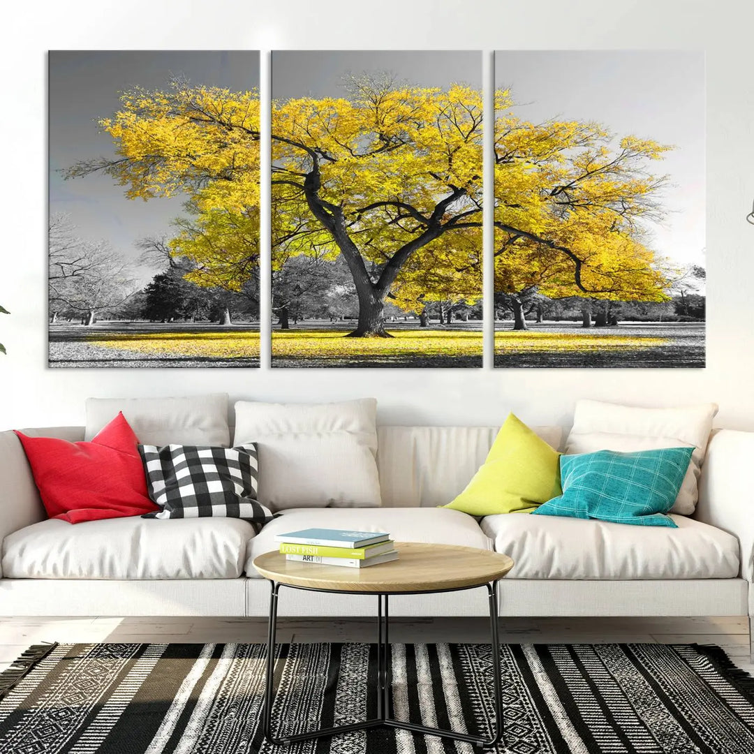 The "Big Yellow Tree Canvas Wall Art Print Black White Yellow Art Painting" showcases a large yellow tree in a park.