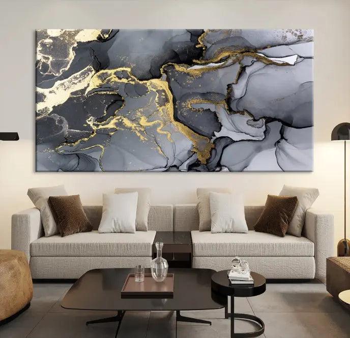 The Black Marble Fluid Effect Wall Art Abstract Canvas Wall Art Print features a triptych of black, gray, and gold abstract designs on museum-quality canvas. This elegant piece is ready to hang and includes a UV-protective coating to ensure its enduring allure.