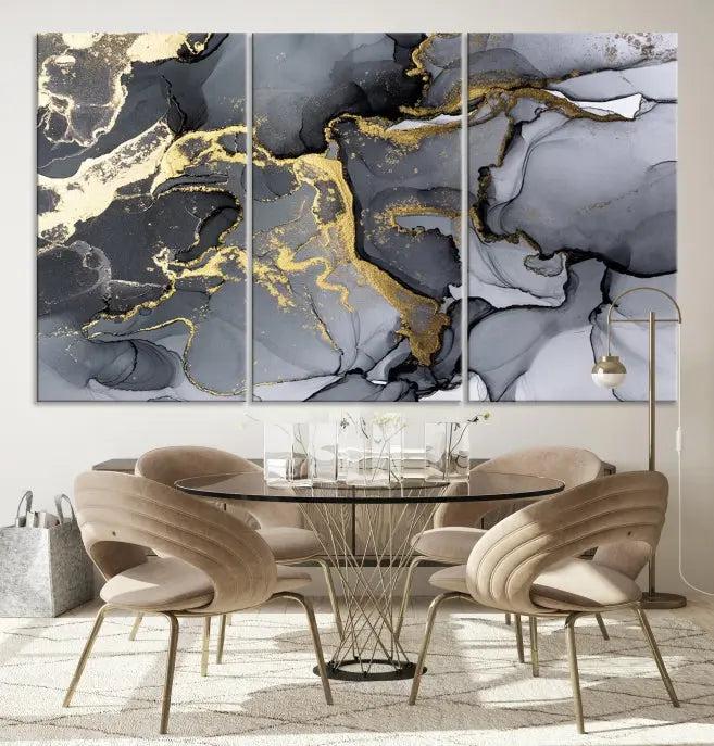 The Black Marble Fluid Effect Wall Art Abstract Canvas Wall Art Print features a triptych of black, gray, and gold abstract designs on museum-quality canvas. This elegant piece is ready to hang and includes a UV-protective coating to ensure its enduring allure.