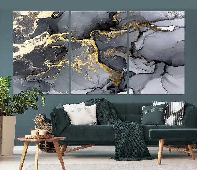 The Black Marble Fluid Effect Wall Art Abstract Canvas Wall Art Print features a triptych of black, gray, and gold abstract designs on museum-quality canvas. This elegant piece is ready to hang and includes a UV-protective coating to ensure its enduring allure.