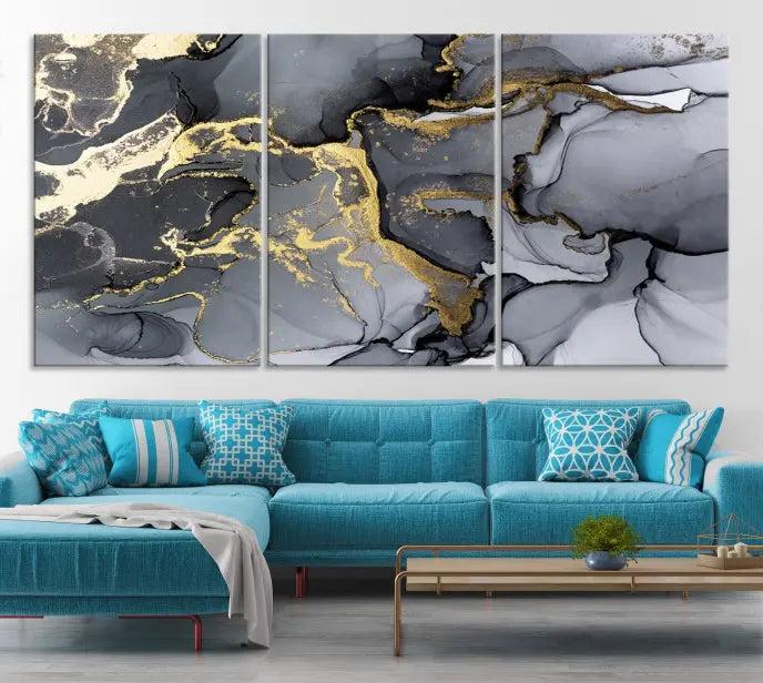 The Black Marble Fluid Effect Wall Art Abstract Canvas Wall Art Print features a triptych of black, gray, and gold abstract designs on museum-quality canvas. This elegant piece is ready to hang and includes a UV-protective coating to ensure its enduring allure.