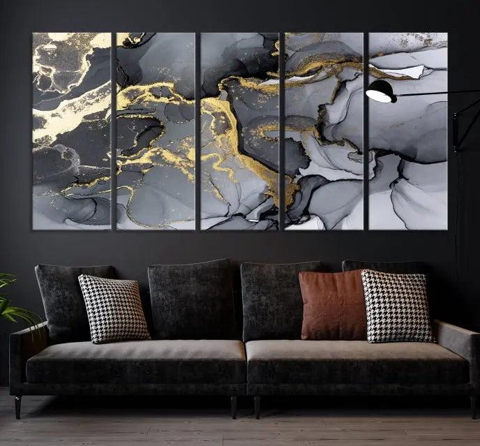 The Black Marble Fluid Effect Wall Art Abstract Canvas Wall Art Print features a triptych of black, gray, and gold abstract designs on museum-quality canvas. This elegant piece is ready to hang and includes a UV-protective coating to ensure its enduring allure.