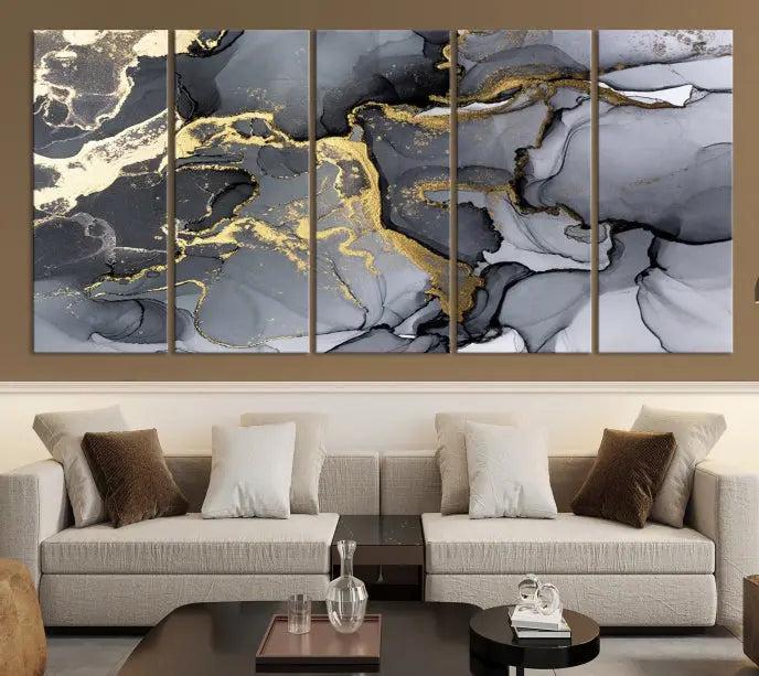 The Black Marble Fluid Effect Wall Art Abstract Canvas Wall Art Print features a triptych of black, gray, and gold abstract designs on museum-quality canvas. This elegant piece is ready to hang and includes a UV-protective coating to ensure its enduring allure.