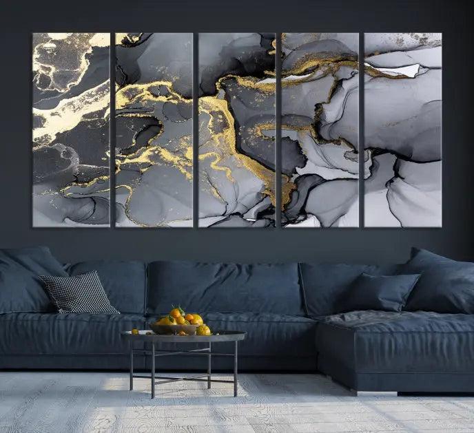 The Black Marble Fluid Effect Wall Art Abstract Canvas Wall Art Print features a triptych of black, gray, and gold abstract designs on museum-quality canvas. This elegant piece is ready to hang and includes a UV-protective coating to ensure its enduring allure.