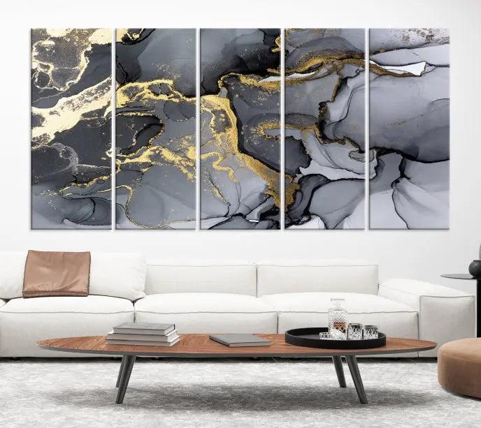 The Black Marble Fluid Effect Wall Art Abstract Canvas Wall Art Print features a triptych of black, gray, and gold abstract designs on museum-quality canvas. This elegant piece is ready to hang and includes a UV-protective coating to ensure its enduring allure.