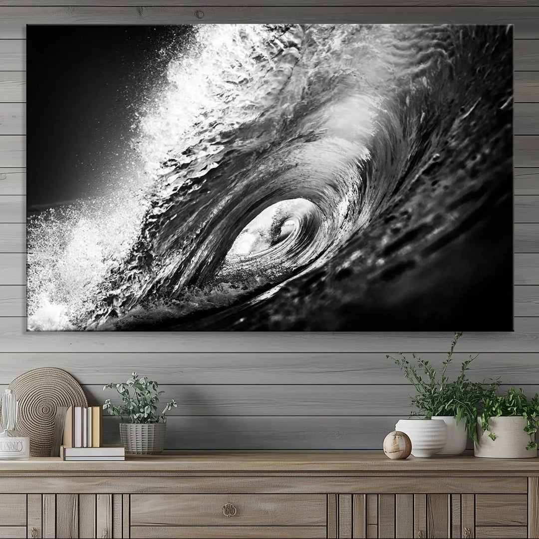 A three-panel display of the "Black Ocean Wave at Sunset Canvas Art" features a vibrant depiction of water waves in black and white, perfectly capturing the coastal ambiance.