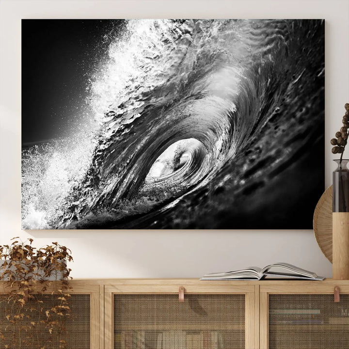 A three-panel display of the "Black Ocean Wave at Sunset Canvas Art" features a vibrant depiction of water waves in black and white, perfectly capturing the coastal ambiance.