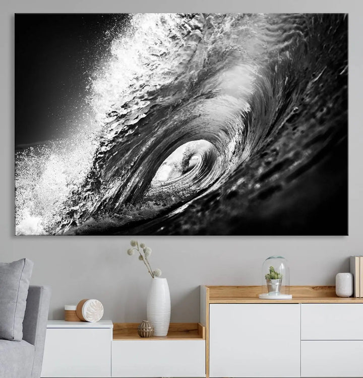 A three-panel display of the "Black Ocean Wave at Sunset Canvas Art" features a vibrant depiction of water waves in black and white, perfectly capturing the coastal ambiance.