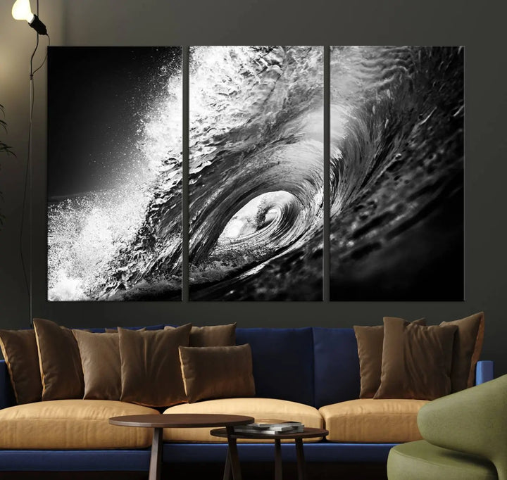 A three-panel display of the "Black Ocean Wave at Sunset Canvas Art" features a vibrant depiction of water waves in black and white, perfectly capturing the coastal ambiance.