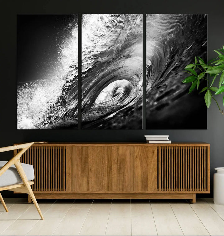 A three-panel display of the "Black Ocean Wave at Sunset Canvas Art" features a vibrant depiction of water waves in black and white, perfectly capturing the coastal ambiance.