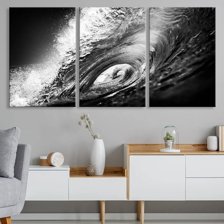 A three-panel display of the "Black Ocean Wave at Sunset Canvas Art" features a vibrant depiction of water waves in black and white, perfectly capturing the coastal ambiance.