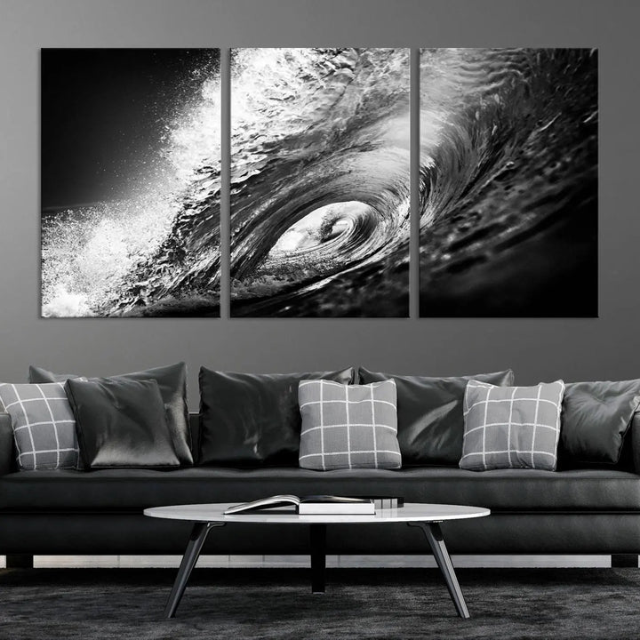 A three-panel display of the "Black Ocean Wave at Sunset Canvas Art" features a vibrant depiction of water waves in black and white, perfectly capturing the coastal ambiance.