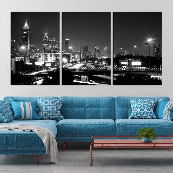 The living room features the striking Black White Atlanta Wall Art Cityscape Canvas Print on the wall. This gallery-wrapped artwork is beautifully displayed on museum-quality canvas, complete with a UV-protective coating to maintain its allure.