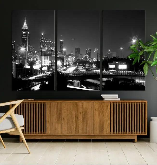 The living room features the striking Black White Atlanta Wall Art Cityscape Canvas Print on the wall. This gallery-wrapped artwork is beautifully displayed on museum-quality canvas, complete with a UV-protective coating to maintain its allure.