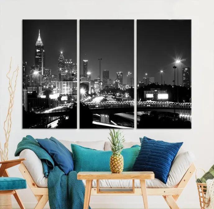 The living room features the striking Black White Atlanta Wall Art Cityscape Canvas Print on the wall. This gallery-wrapped artwork is beautifully displayed on museum-quality canvas, complete with a UV-protective coating to maintain its allure.