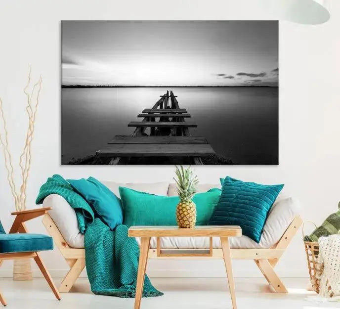 Titled "Black & White Old Wooden Pier Wall Art Canvas Print," this stunning monochrome triptych of a pier at sunset is printed on museum-grade canvases. It offers an effortlessly chic ambiance to your space with its ready-to-hang design.