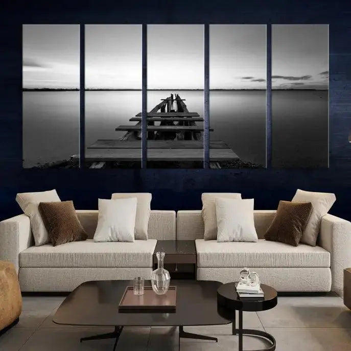 Titled "Black & White Old Wooden Pier Wall Art Canvas Print," this stunning monochrome triptych of a pier at sunset is printed on museum-grade canvases. It offers an effortlessly chic ambiance to your space with its ready-to-hang design.