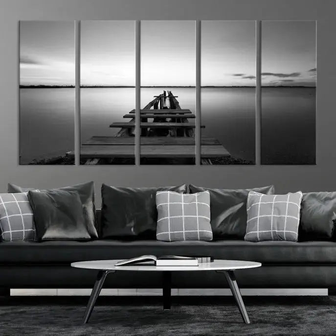 Titled "Black & White Old Wooden Pier Wall Art Canvas Print," this stunning monochrome triptych of a pier at sunset is printed on museum-grade canvases. It offers an effortlessly chic ambiance to your space with its ready-to-hang design.