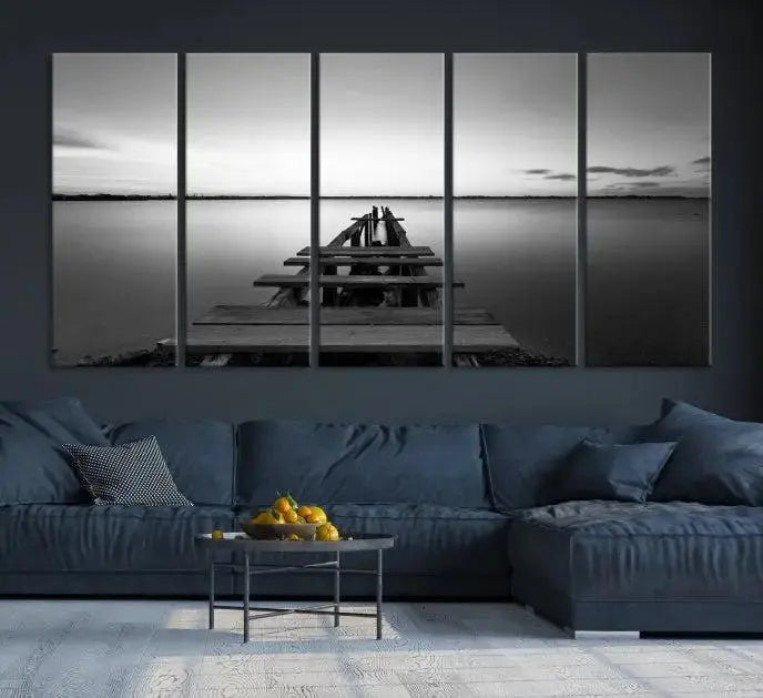 Titled "Black & White Old Wooden Pier Wall Art Canvas Print," this stunning monochrome triptych of a pier at sunset is printed on museum-grade canvases. It offers an effortlessly chic ambiance to your space with its ready-to-hang design.