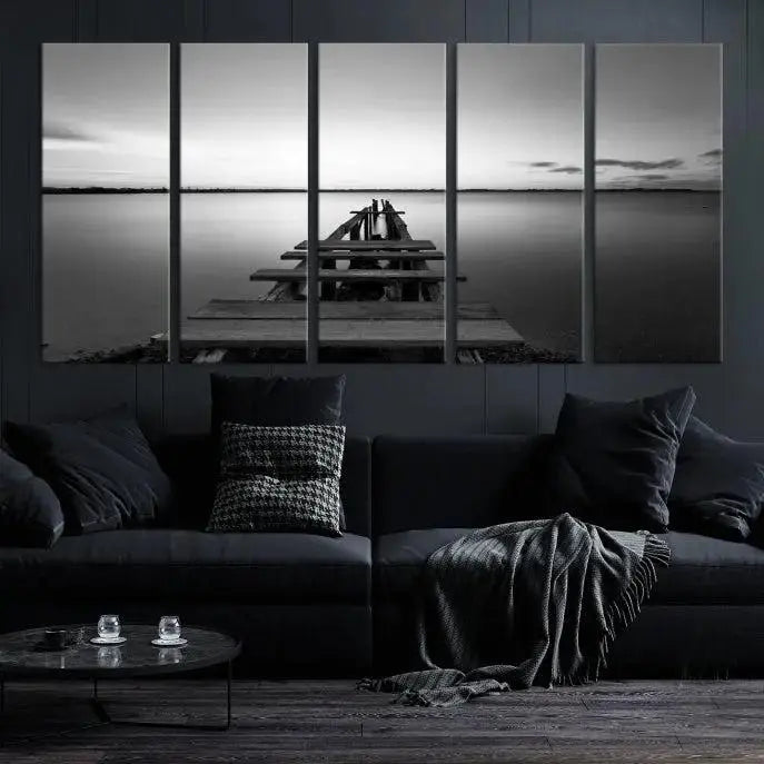 Titled "Black & White Old Wooden Pier Wall Art Canvas Print," this stunning monochrome triptych of a pier at sunset is printed on museum-grade canvases. It offers an effortlessly chic ambiance to your space with its ready-to-hang design.