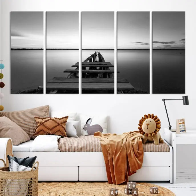 Titled "Black & White Old Wooden Pier Wall Art Canvas Print," this stunning monochrome triptych of a pier at sunset is printed on museum-grade canvases. It offers an effortlessly chic ambiance to your space with its ready-to-hang design.