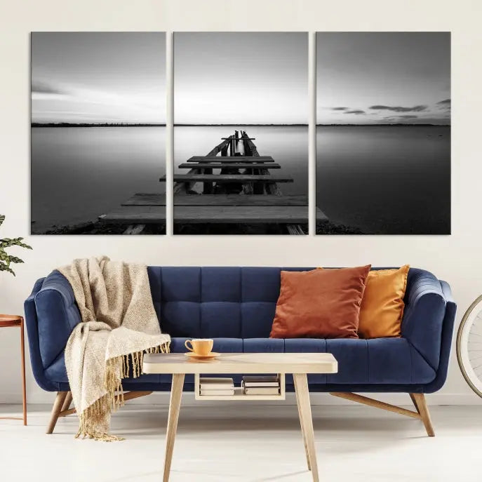 Titled "Black & White Old Wooden Pier Wall Art Canvas Print," this stunning monochrome triptych of a pier at sunset is printed on museum-grade canvases. It offers an effortlessly chic ambiance to your space with its ready-to-hang design.