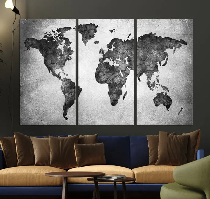 A Black and Gray World Map Canvas Wall Art Print, created on museum-quality canvas with UV-protective coating, hangs prominently.