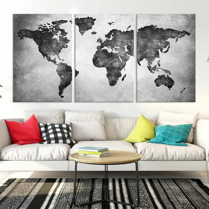 A Black and Gray World Map Canvas Wall Art Print, created on museum-quality canvas with UV-protective coating, hangs prominently.