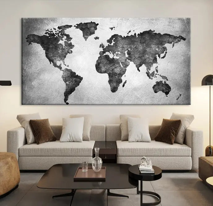 A Black and Gray World Map Canvas Wall Art Print, created on museum-quality canvas with UV-protective coating, hangs prominently.