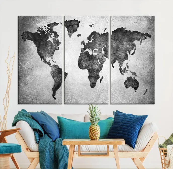 A Black and Gray World Map Canvas Wall Art Print, created on museum-quality canvas with UV-protective coating, hangs prominently.