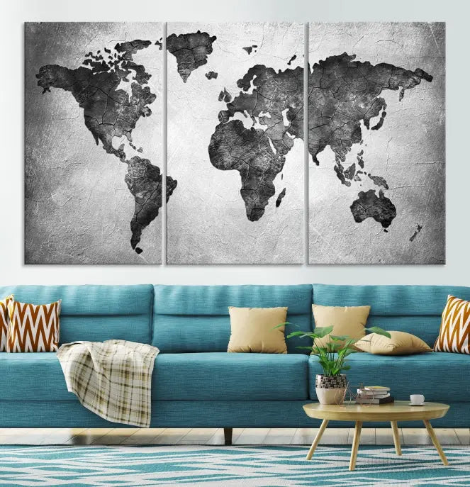 A Black and Gray World Map Canvas Wall Art Print, created on museum-quality canvas with UV-protective coating, hangs prominently.