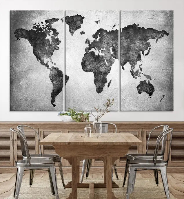 A Black and Gray World Map Canvas Wall Art Print, created on museum-quality canvas with UV-protective coating, hangs prominently.