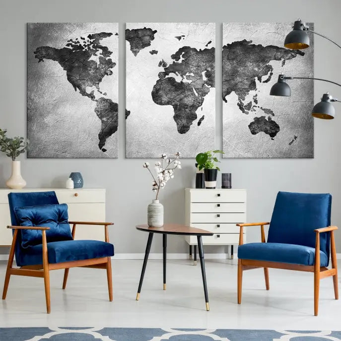 A Black and Gray World Map Canvas Wall Art Print, created on museum-quality canvas with UV-protective coating, hangs prominently.