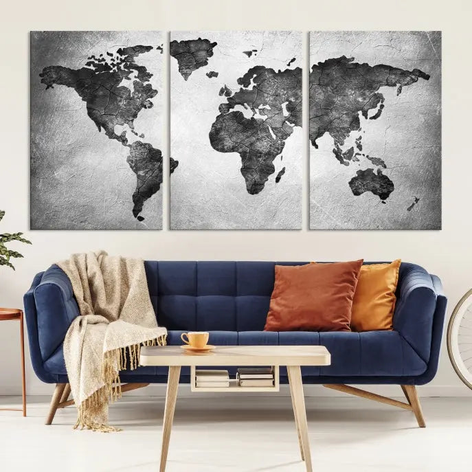 A Black and Gray World Map Canvas Wall Art Print, created on museum-quality canvas with UV-protective coating, hangs prominently.