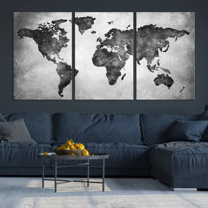 A Black and Gray World Map Canvas Wall Art Print, created on museum-quality canvas with UV-protective coating, hangs prominently.