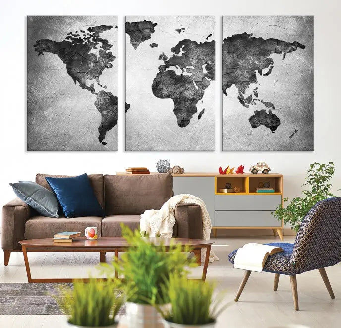 A Black and Gray World Map Canvas Wall Art Print, created on museum-quality canvas with UV-protective coating, hangs prominently.