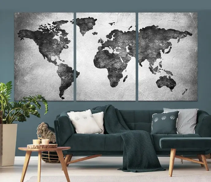 A Black and Gray World Map Canvas Wall Art Print, created on museum-quality canvas with UV-protective coating, hangs prominently.