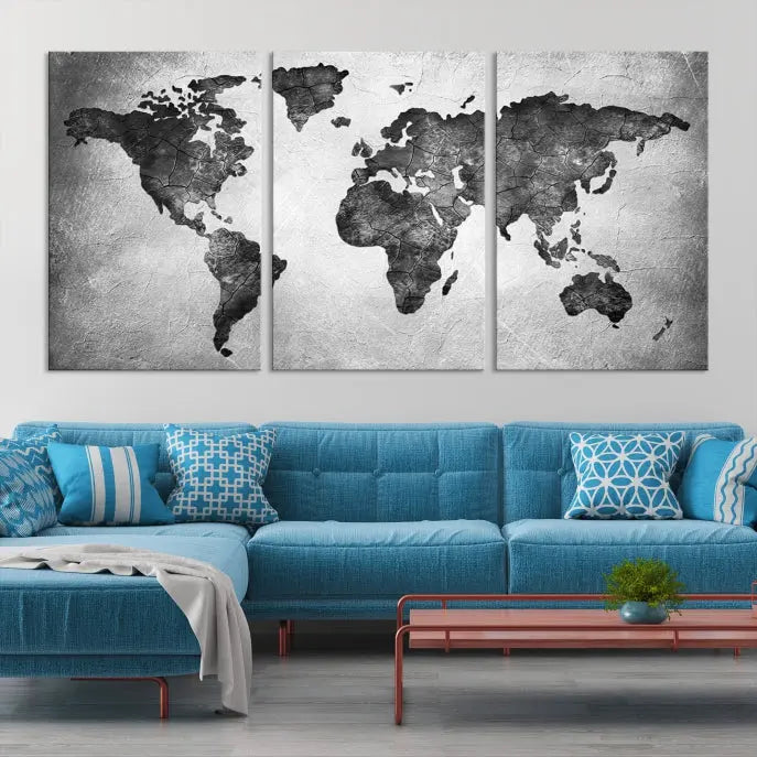 A Black and Gray World Map Canvas Wall Art Print, created on museum-quality canvas with UV-protective coating, hangs prominently.