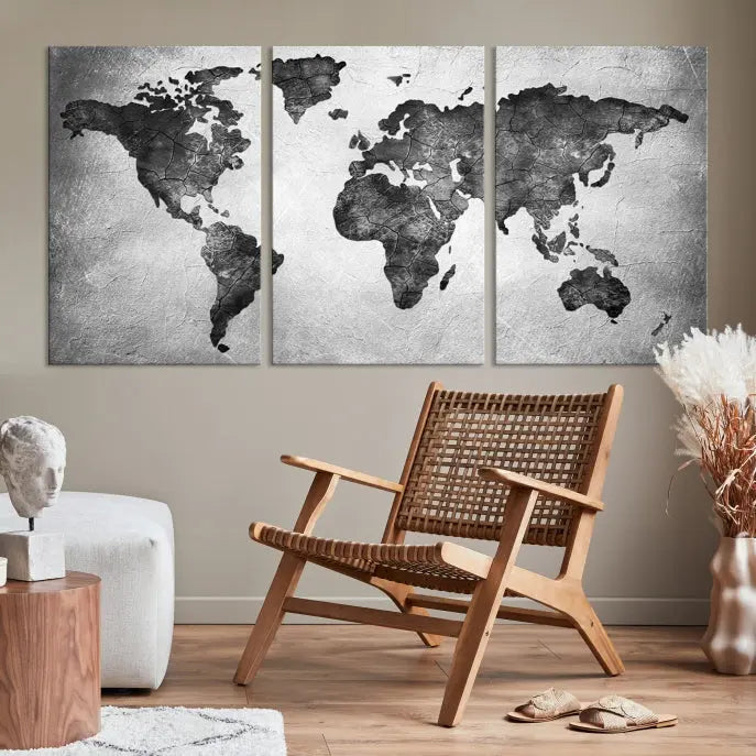 A Black and Gray World Map Canvas Wall Art Print, created on museum-quality canvas with UV-protective coating, hangs prominently.