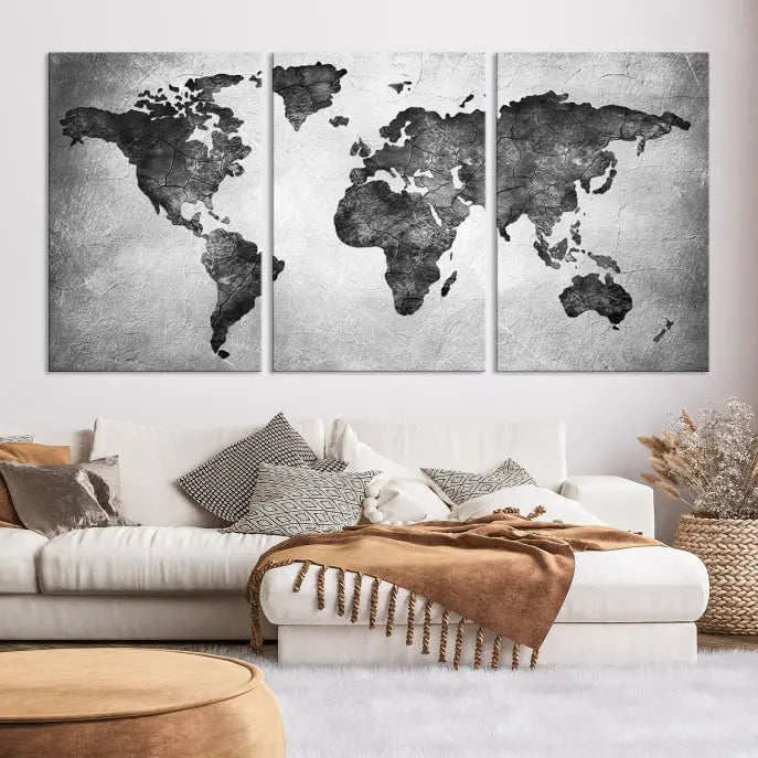 A Black and Gray World Map Canvas Wall Art Print, created on museum-quality canvas with UV-protective coating, hangs prominently.