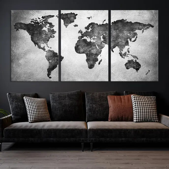 A Black and Gray World Map Canvas Wall Art Print, created on museum-quality canvas with UV-protective coating, hangs prominently.