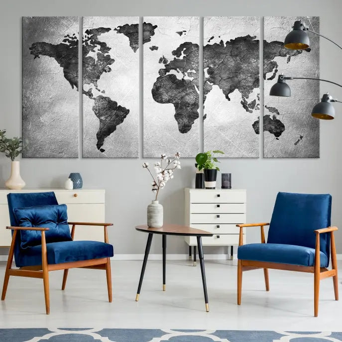 A Black and Gray World Map Canvas Wall Art Print, created on museum-quality canvas with UV-protective coating, hangs prominently.