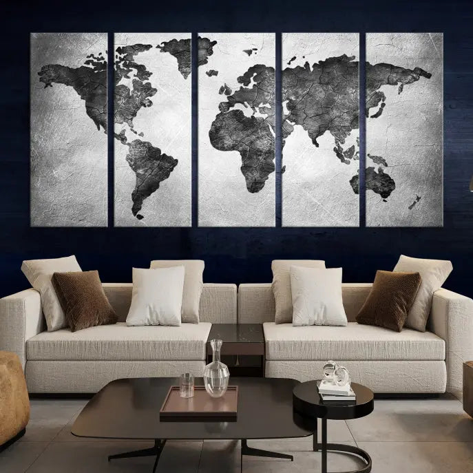 A Black and Gray World Map Canvas Wall Art Print, created on museum-quality canvas with UV-protective coating, hangs prominently.