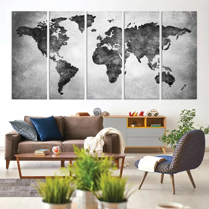 A Black and Gray World Map Canvas Wall Art Print, created on museum-quality canvas with UV-protective coating, hangs prominently.