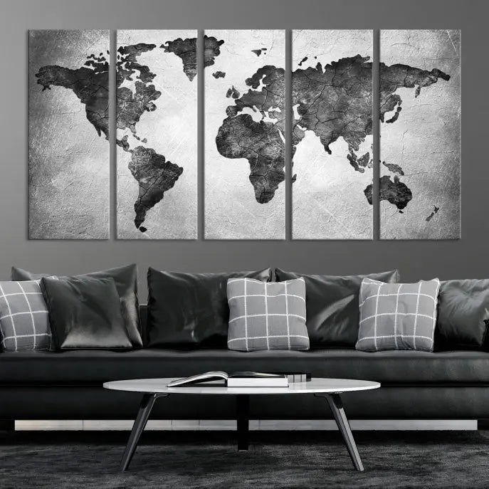 A Black and Gray World Map Canvas Wall Art Print, created on museum-quality canvas with UV-protective coating, hangs prominently.